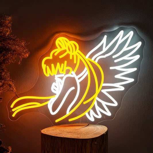 Neon sign of sailor moon creature on a wooden base against a dark background