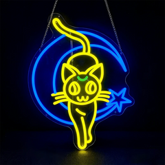 Neon sign of a cat with a blue crescent moon and star on a black background