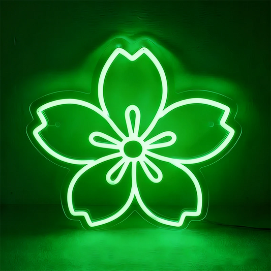 Neon green sakura cherry blossom sign on a dark background.
