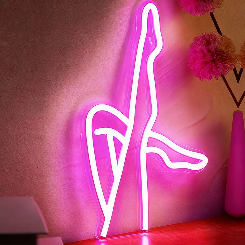 Neon sign of legs on a pink background