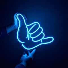 Neon ice blue hand sign with a thumb up on a dark background