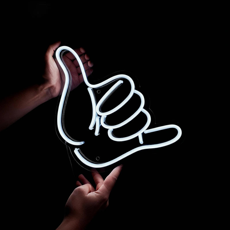 Neon sign shaped like a hand giving a thumbs-up on a black background