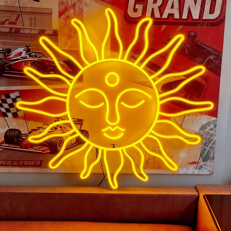 Yellow neon sun-shaped sign with face design in front of a racing car poster.