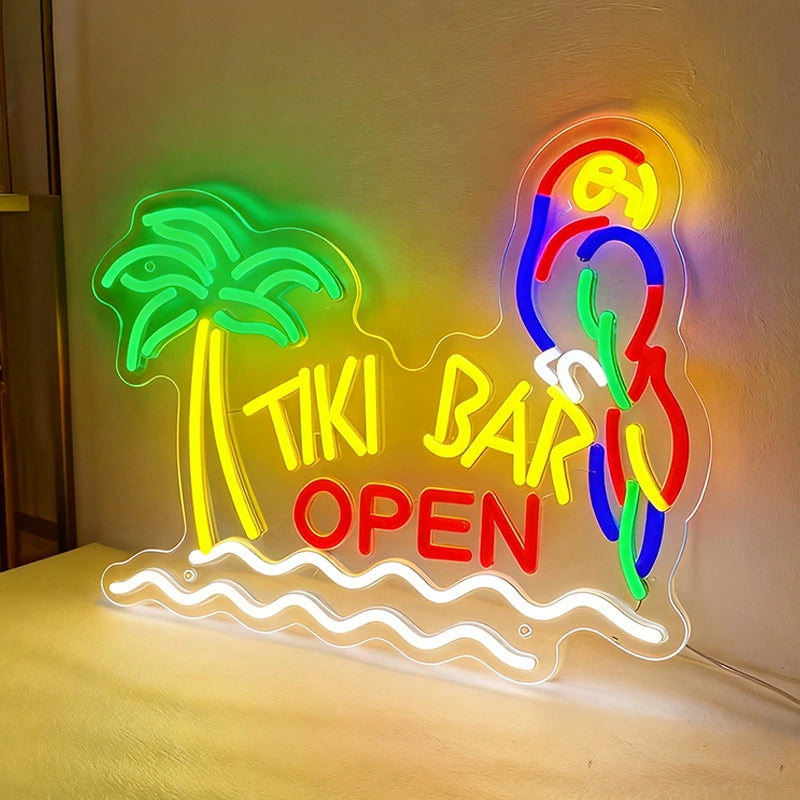 Neon sign with palm tree, parrot, and 'Tiki Bar Open' text on a plain background
