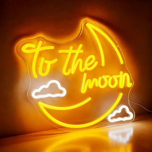 Neon sign with 'To the moon' text on a crescent moon shape against a dark background