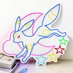 Neon sign of a cartoon character umbreon with stars  leaning against the wall.