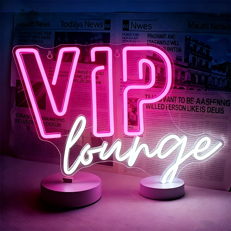 Neon sign with 'VIP lounge' text in front of a newspaper background