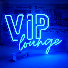 Neon sign with 'VIP lounge' text on a blue background