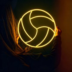 Person holding a glowing lemon yellow volleyball neon sign against a dark background