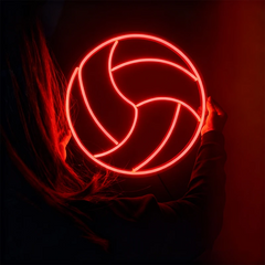 Person holding a glowing red volleyball neon sign against a dark background