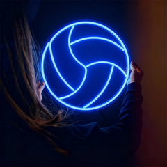 Person holding a glowing blue color volleyball neon sign in a dark setting