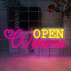 Neon sign with 'OPEN Welcome' text on a tiled wall.