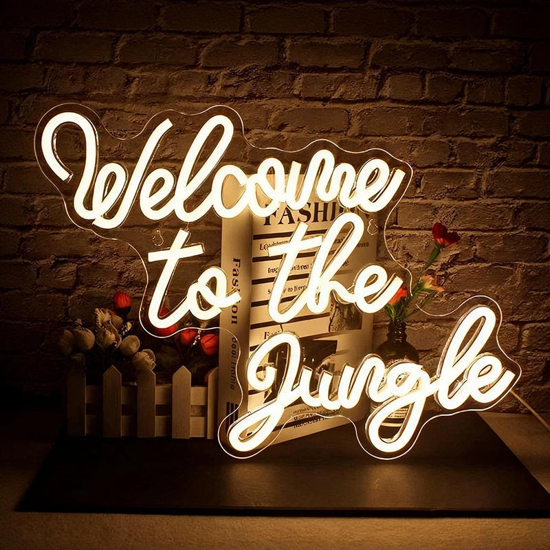 Neon sign with 'Welcome to the Jungle' text on a brick wall background
