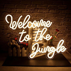 Neon sign with 'Welcome to the Jungle' text on a brick wall background