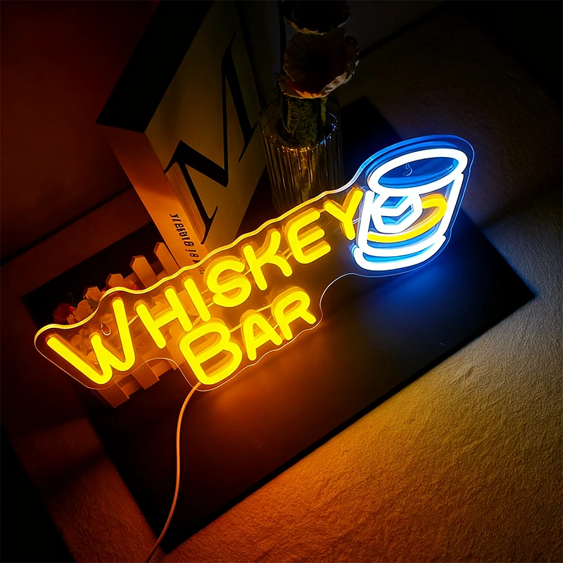 Neon sign with 'Whiskey Bar' and a glass of whiskey on a dark background
