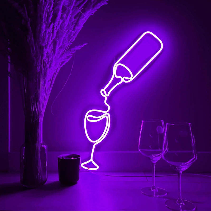Neon purple light art of a wine bottle and glass on a dark background