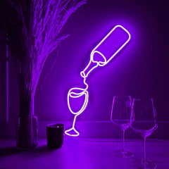 Neon purple light art of a wine bottle and glass on a dark background