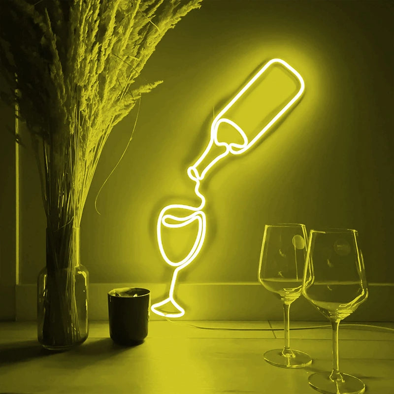 Neon light shaped like a bottle and glasses on a dark background