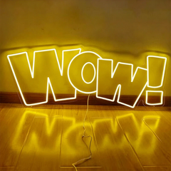 Neon sign with 'WOW!' letters on a lemon yellow background
