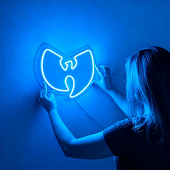 Person holding a neon Wu-Tang Clan logo against a blue background