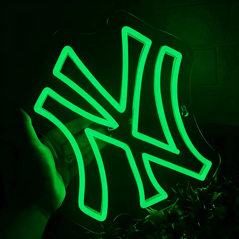 Neon green yankees logo on a dark background