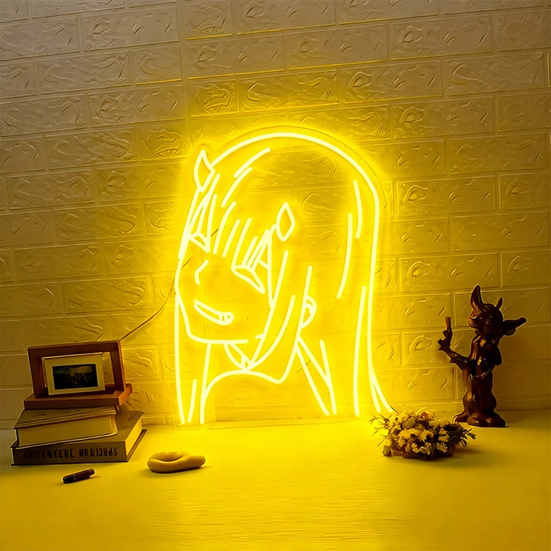 Neon light shaped like yellow zero two with decorative items below.