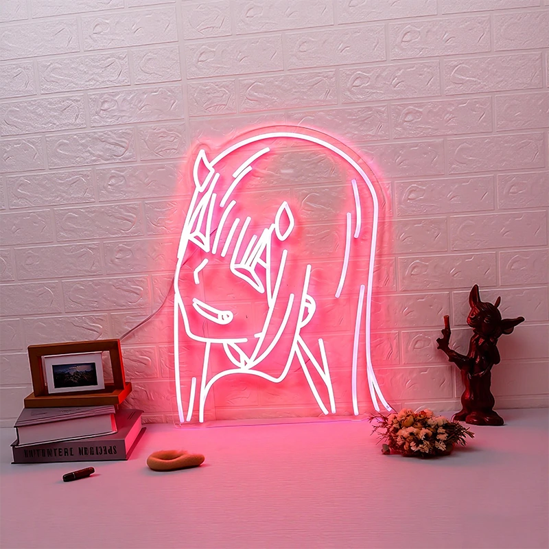 Neon sign of light pink zero two on a textured white brick wall with decorative items below.