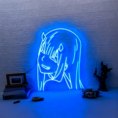 Neon sign of blue zero two on a textured brick wall with decorative items below.
