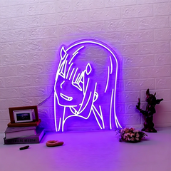Neon sign of purple zero two on a textured brick wall with decorative items below.