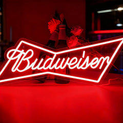 Neon Budweiser sign with red background