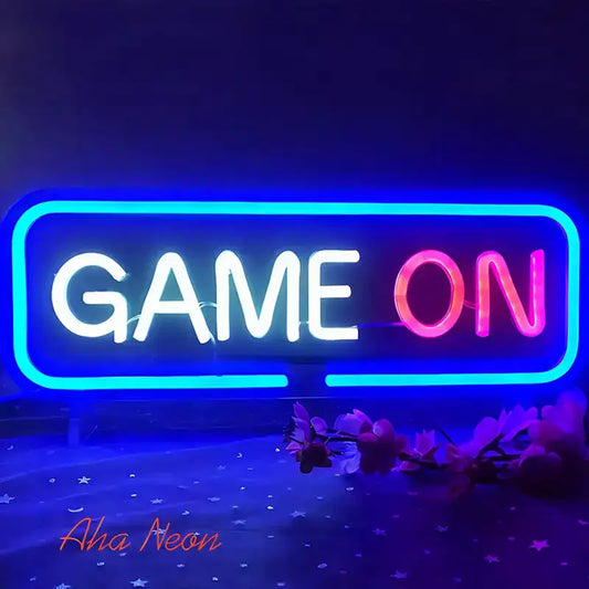 Neon sign with 'GAME ON' text on a dark background