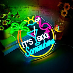 Neon sign with palm trees, flamingo, and 'It's 5 o'clock somewhere' text on a decorative background.