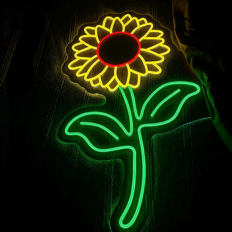 Neon light sculpture of a sunflower on a dark background