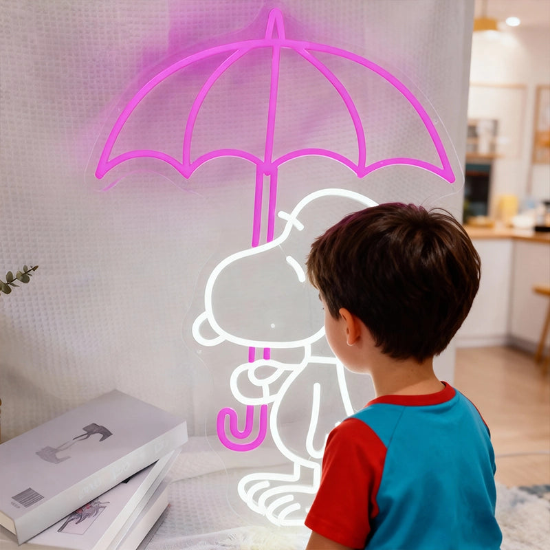 Child looking at a neon sign of a cartoon character with an umbrella on a wall.