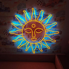 Neon sun-shaped light fixture on a wall with a checkered pattern