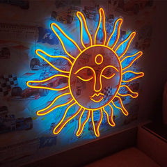 Neon sun-shaped light fixture on a wall with posters in the background